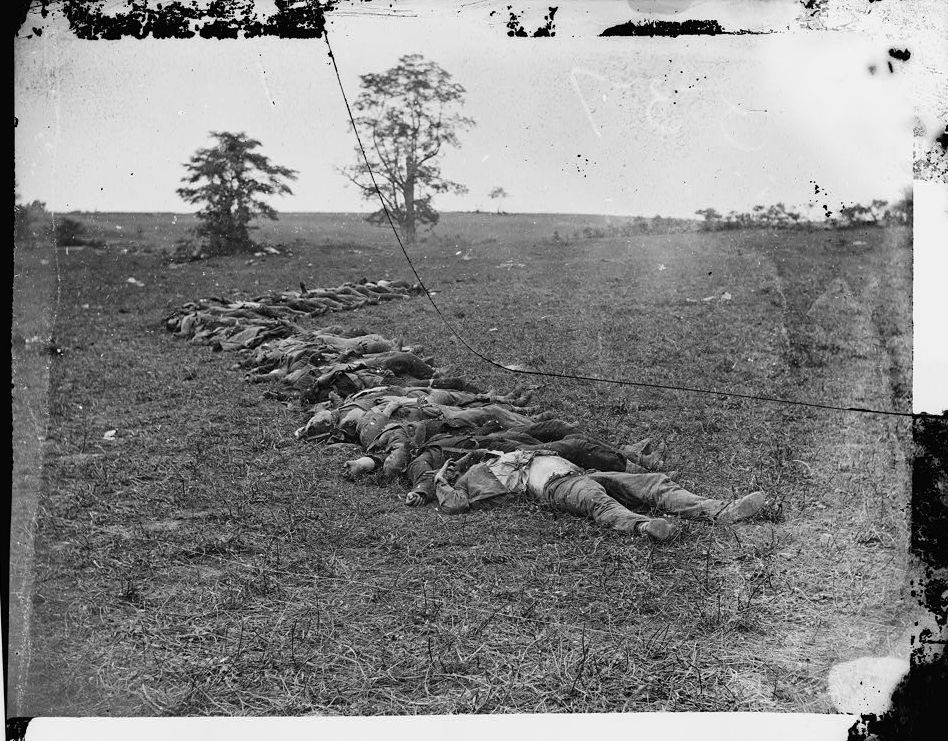 'Bodies of Confederate dead gathered for burial' by Alexander Gardner; Library of Congress, LC-B811- 557 [P&P] LOT 4168 (corresponding print)